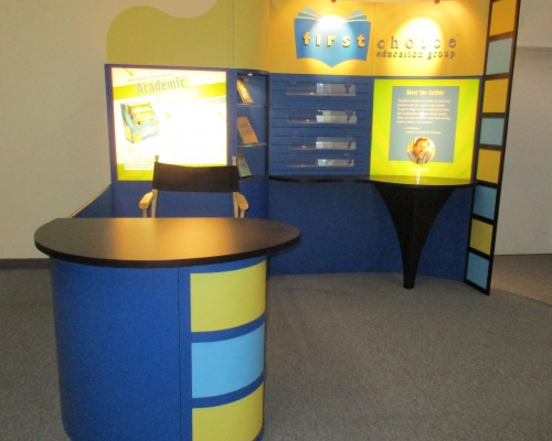 Pre-owned exhibits: 10x10 exhibit with shelves, curved counter and backlit graphics