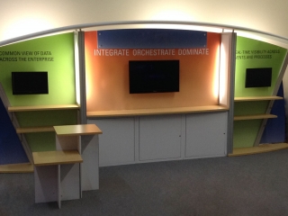 10x20 custom modular exhibit with storage, shelves, monitor mounts and counters