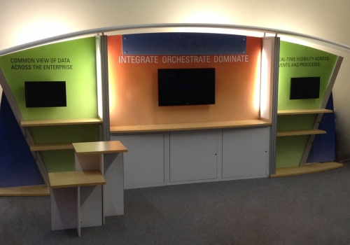 10x20 custom modular exhibit with storage, shelves, monitor mounts and counters