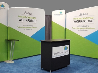 HealthcareSource’s 10x20 tension fabric trade show display with counter can be reconfigured to fit any booth space
